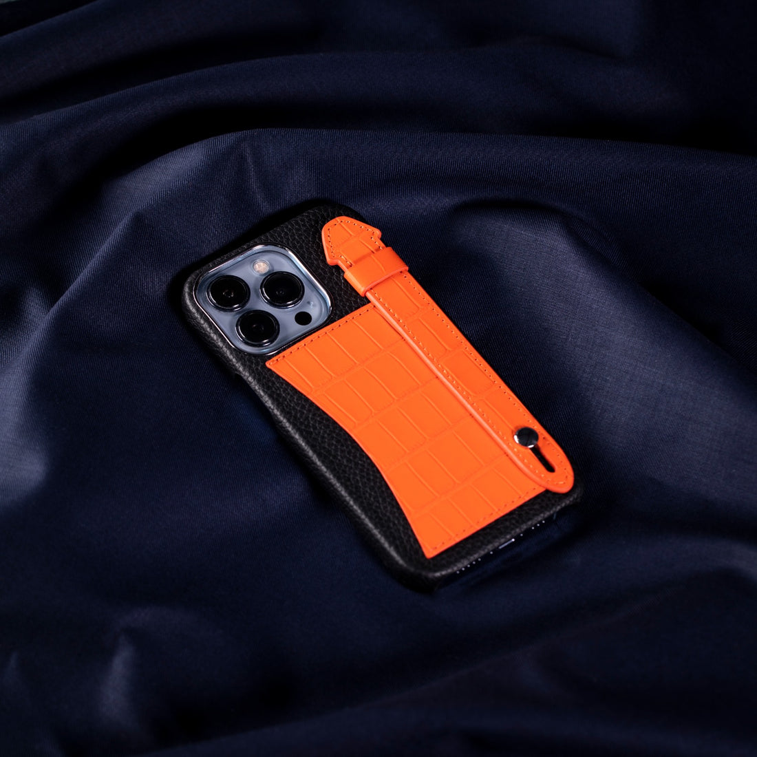 GLANCES: crocodile black with orange pocket and strap